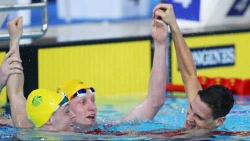 Larkin (right) celebrated with Beaver (left) and Lawson following the 200m backstroke final. 