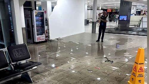Heavy rain has caused flash flooding at Sydney Airport.