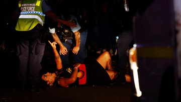 Lidia Thorpe is removed by police after protesting during the Gay and Lesbian Mardi Gras parade. 