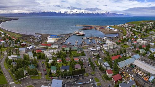 Aerial panorama of Husavik town and the harbour.