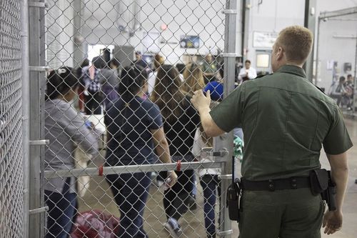 Parents who have been separated from their children at a detention facility in McAllen, Texas. Picture: AAP