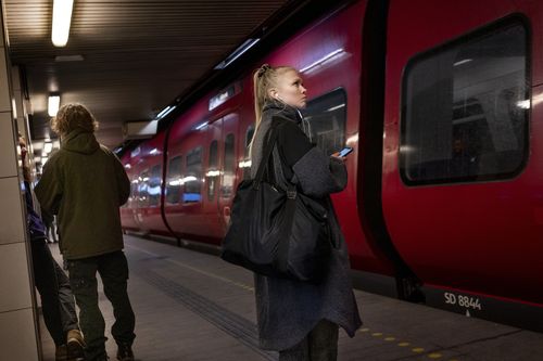 Passengers at Noerreport station in Copenhagen, Denmark on February 1, 2022. Restrictions have been lifted in Denmark. 