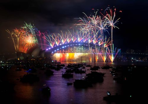 Fireworks light up the skies above Sydney Harbour at midnight on New Year's Eve. 31st December 2022 