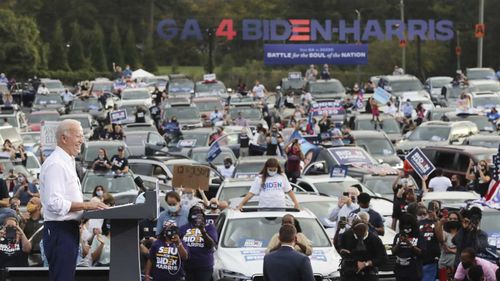 Joe Biden speaks at a socially distanced 'drive-in' rally in Georgia.