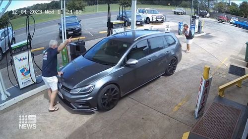 Thieves drive off with Toowoomba petrol station owner Clint Webber on bonnet. 