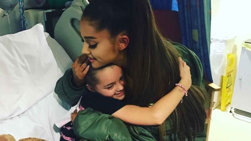 Ariana Grande embraces one of her fans injured in the Manchester bombing. (Twitter)