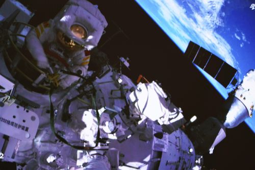 Chinese astronaut Cai Xuzhe exiting the station lab module Wentian.