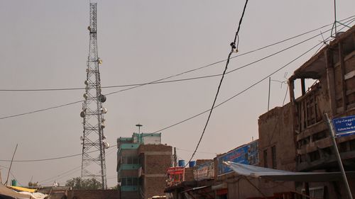 A communication tower stands in Jalalabad, Afghanistan, Wednesday, Oct. 1, 2025, after some networks were restored following an outage that began Monday.