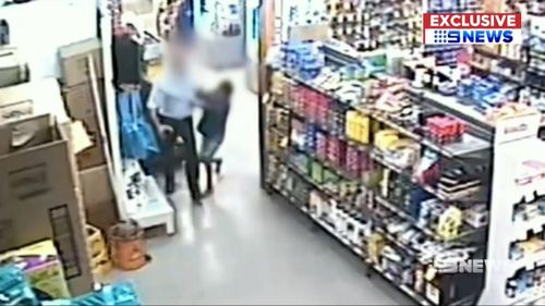 Separate video shows the shopkeeper detaining the young thief.