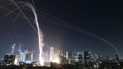 Israeli Iron Dome air defense system fires to intercept missiles over Tel Aviv, Israel, Friday, June 13, 2025. (AP Photo/Tomer Neuberg)