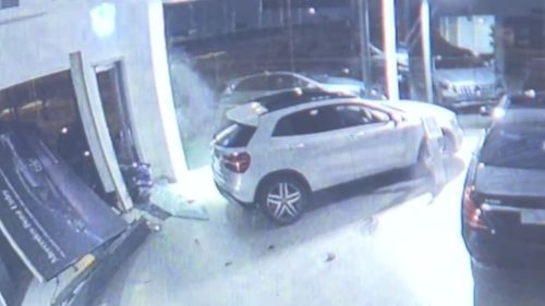 The sedan narrowly missed ploughing into several Mercedes vehicles. (9NEWS)