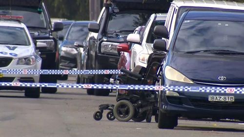 Detectives and the riot squad closed off Phillip Street following the shoot, gathering evidence and photographing the abandoned wheelchair. Picture: 9NEWS