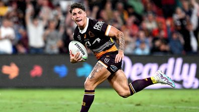 Reece Walsh of the Broncos breaks away from the defence to score a try during the round 2 NRL match between the Brisbane Broncos and the North Queensland Cowboys at Suncorp Stadium on March 10, 2023 in Brisbane, Australia. (Photo by Bradley Kanaris/Getty Images)