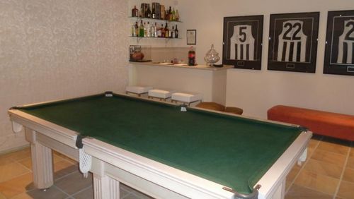 The home has a billiard room with bar. 