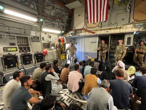 U.S. Marine Corps Gen. Frank McKenzie, the commander of U.S. Central Command, enters a plane evacuating people, at Hamid Karzai International Airport, Afghanistan, Tuesday, Aug. 17, 2021. 