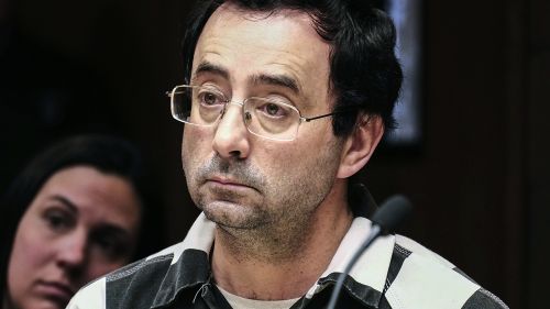 In this Feb. 17, 2017, file photo, Dr. Larry Nassar listens to testimony of a witness during a preliminary hearing, in Lansing, Michigan.