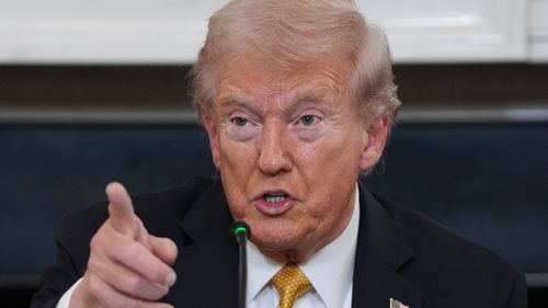 President Donald Trump answers questions from reporters during a roundtable on criminal cartels in the State Dining Room of the White House, Thursday, Oct. 23, 2025, in Washington. (AP Photo/Evan Vucci)