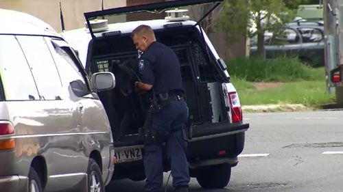 Officers and police dogs searched the scene and surrounding area. (9NEWS)