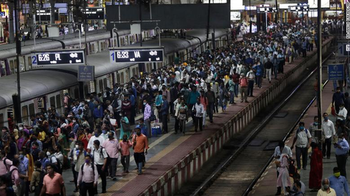 Commuters wait for local trains during peak hours at Chhatrapati Shivaji Maharaj Terminus in Mumbai. 