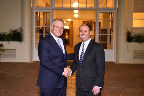 Prime Minister Scott Morrison and Deputy Liberal leader Josh Frydenberg after a swearing in ceremony at Government House in Canberra