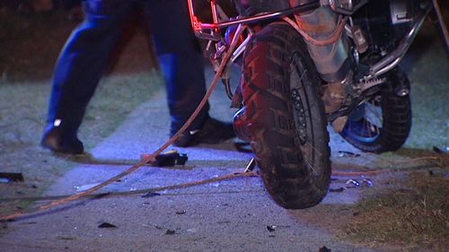 The wire become tangled around the motorbike's back wheel. (9NEWS)