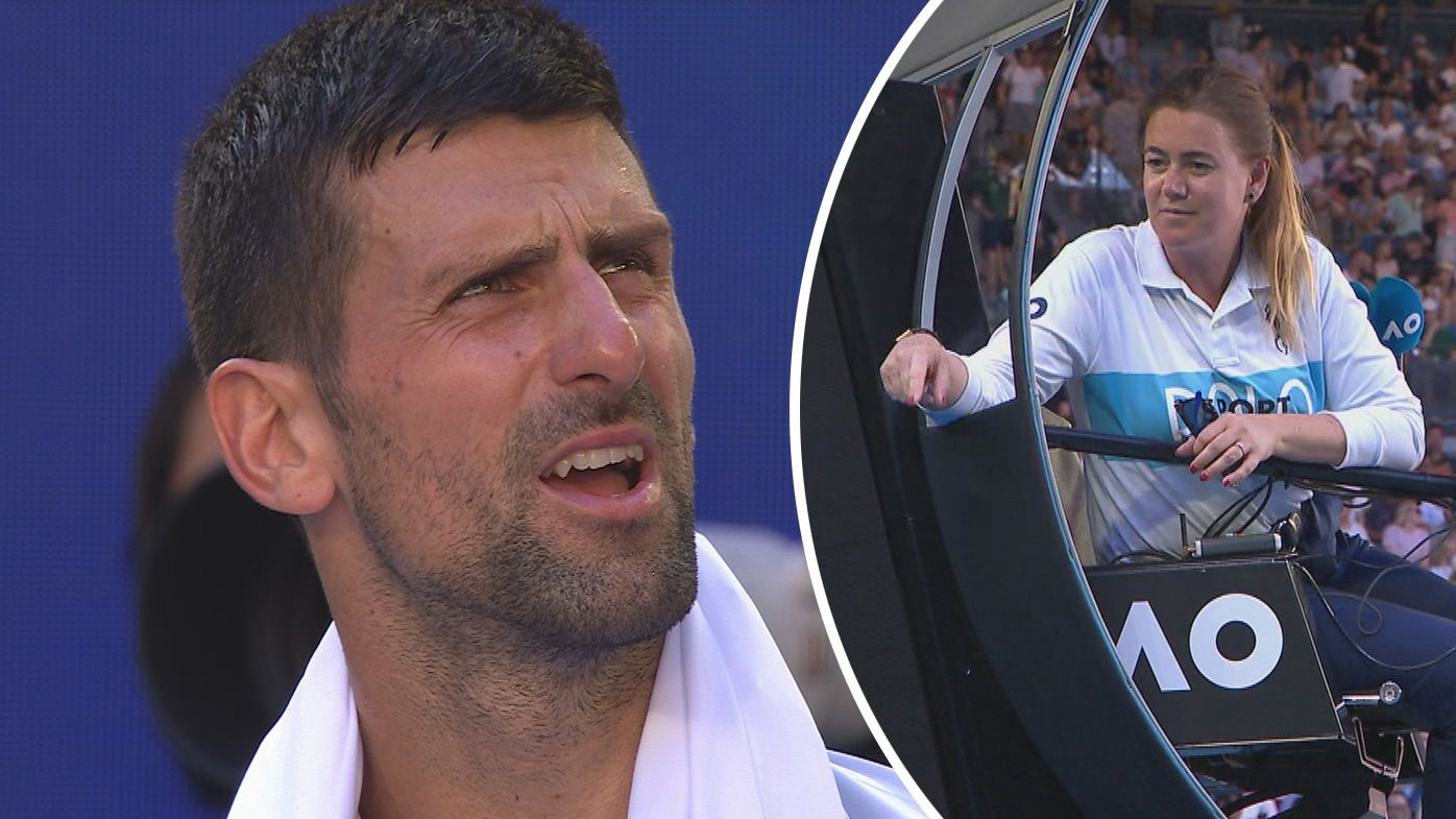 Novak Djokovic complaining to the umpire about the brightness of the lights on Rod Laver Arena in his quarterfinal against Taylor Fritz.