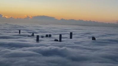 A travel warning has been issued as heavy fog blankets Brisbane this morning. 