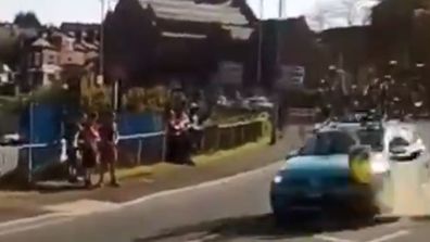 A rogue driver crashed into a traffic island narrowly missing the man.