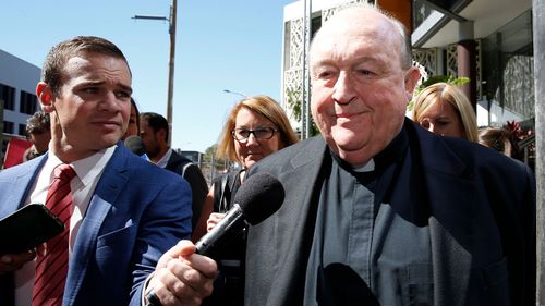 9NEWS reporter Jarrad Brevi (left) offers Archbishop Wilson an opportunity to comment. (AAP)
