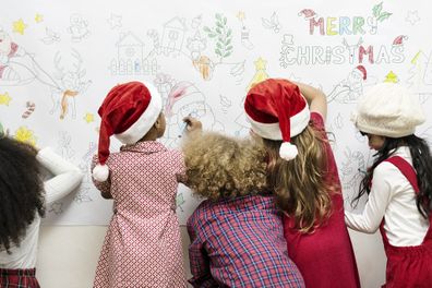 Kids drawing on a Christmas decoration