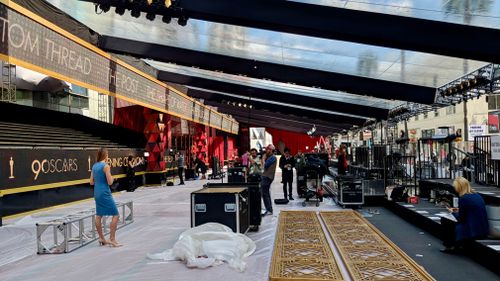 Crews are still working to assembly the red carpet set. (9NEWS/Ehsan Knopf)