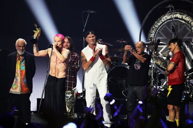 Red Hot Chili Peppers vocalist Anthony Kiedis, bassist Flea and guitarist John Frusciante receive the Global Icon Award to US rock band onstage at the 2022 MTV VMAs at Prudential Center on August 28, 2022 in Newark, New Jersey. 