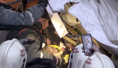 The moment the 10- month-old was saved from the wreckage of the apartments.