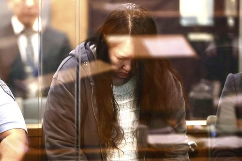Hakyung Lee stands in the dock at the High Court in Auckland, New Zealand, Monday, Sept. 8, 2025. (Lawrence Smith/Stuff Pool Photo via AP)