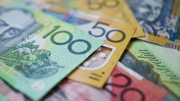 Australian money background showing $100, $50 and $20 notes with a shallow depth of field.