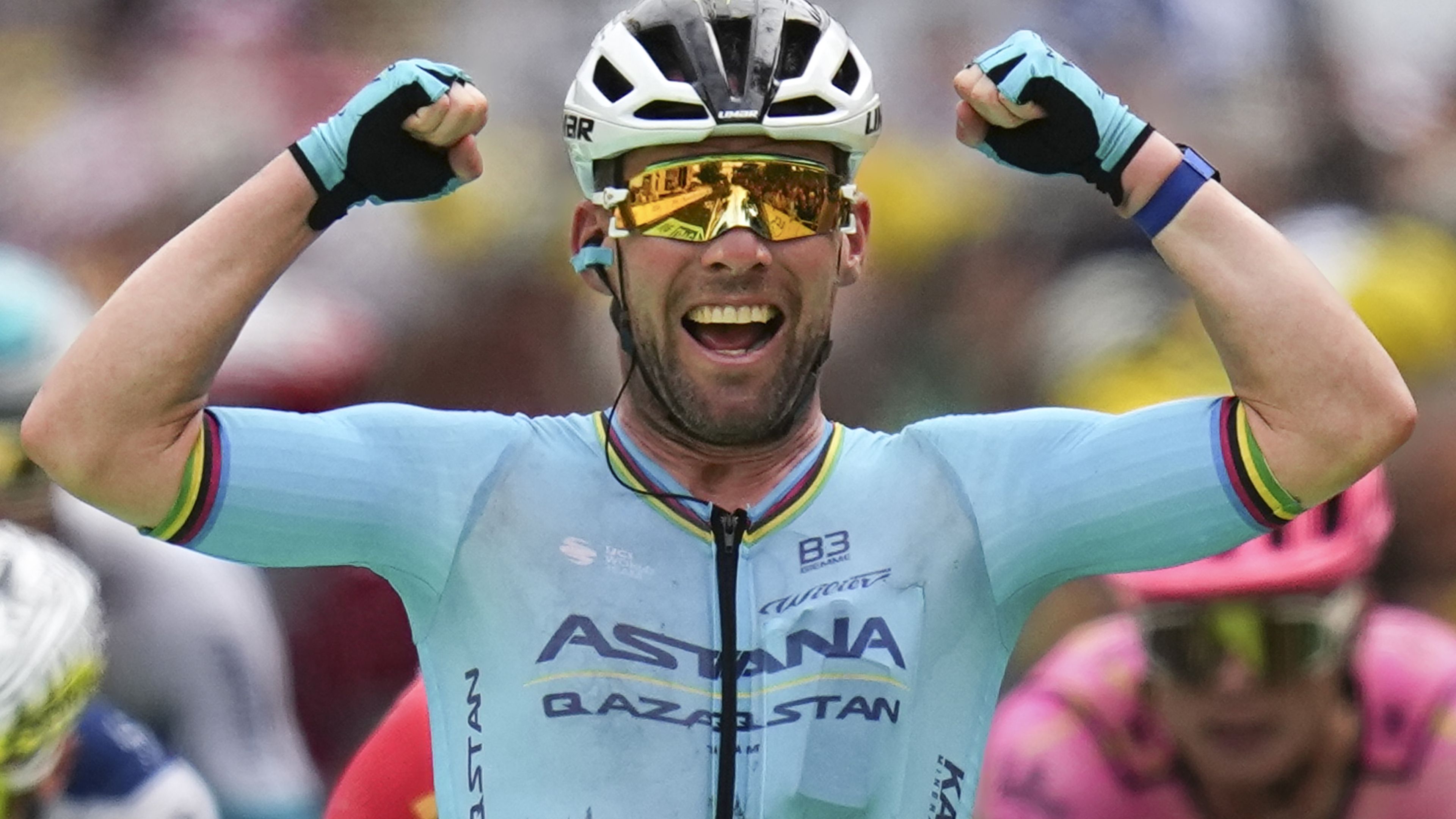 Britain&#x27;s sprinter Mark Cavendish celebrates as he crosses the finish line to win a record 35th Tour de France stage.