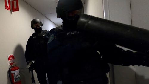 NSW Police broke down the doors at numerous apartments during the raids.