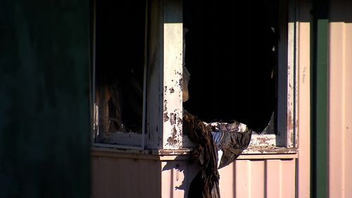 A second man escaped the burning home without injuries.