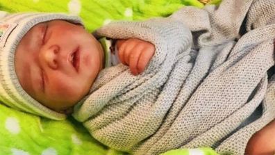 A newborn baby doll was used to promote the couple's GoFundMe page, which asked for donations for funeral costs