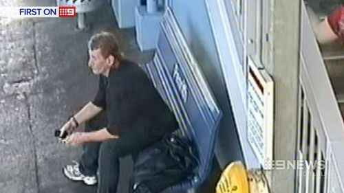 Guards kept a close eye on the man while waiting for police. (9NEWS)