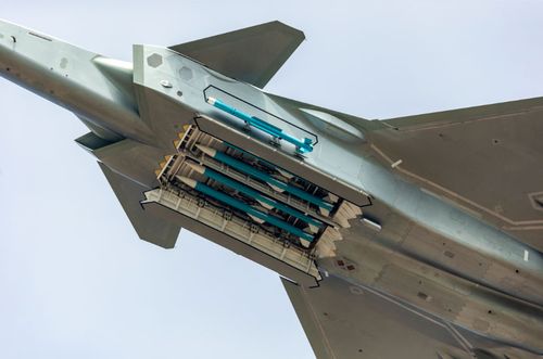 The J-20 opened its weapons bay to show four long-range missiles.