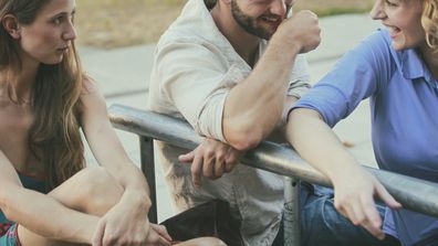 Jelaous friend looking at happy couple. Women. Three friends