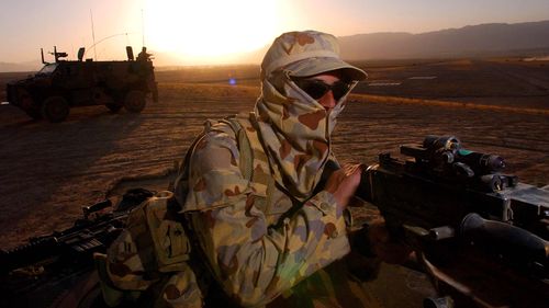 An Australian soldier on patrol near a Forward Operating Base (FOB) in Afghanistan, in 2006.