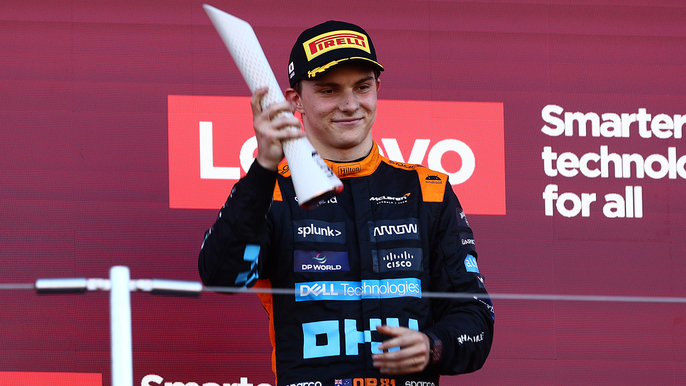 Third-placed Oscar Piastri celebrates on the podium following the Japanese Grand Prix.
