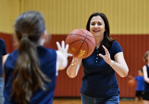 Queensland Premier Annastacia Palaszczuk is seen playing basketball with members of the Wizards Basketball club at the Brisbane Entertainment Centre. (AAP)