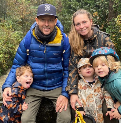 jonnie irwin with his wife and children during a hike outdoors