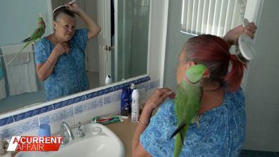 Sue Mariner and Bud in the bathroom together.