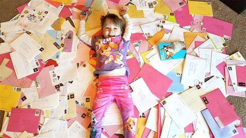 Young girl in the US celebrates birthday with cards from all around the world