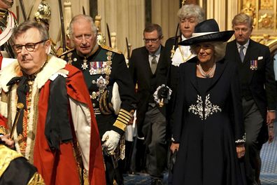 Camilla, Duchess of Cornwall and Prince Charles, Prince of Wales arrive at the Sovereign's Entrance ahead of the State Opening of Parliament at Houses of Parliament on May 10, 2022 in London, England