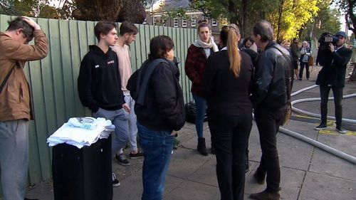 There are 12 homes within the block, with residents forced onto the streets when the fire sparked at 5.50am. (9NEWS)